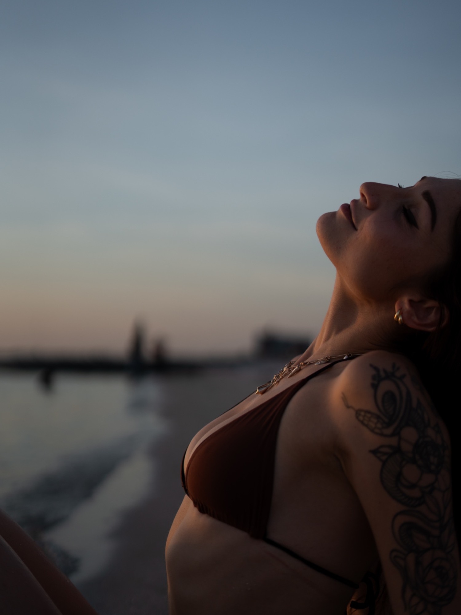 An expressive close portrait beside the ocean
